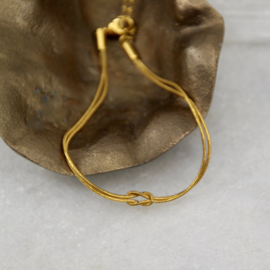 The Eclipse Wore Gold Knot Bracelet